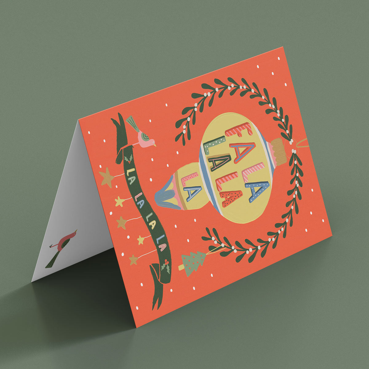 Christmas Card Fa la la with mistletoe, dove Christmas tree and bauble. Illustrated by Studio Peers. Mock details of Festive Card red and gold.