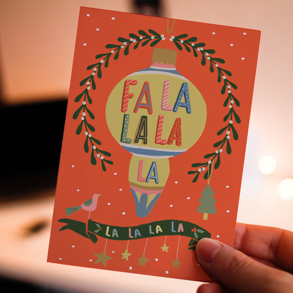 Christmas Card Fa la la with mistletoe, dove Christmas tree and bauble. Illustrated by Studio Peers