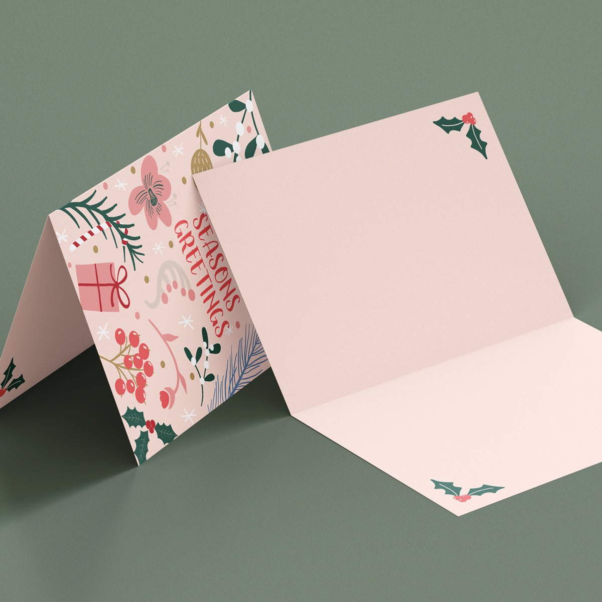 Seasons Greetings Christmas Card pack. Floral design with Holly, gifts and mistletoe. Blank inside with holly detail