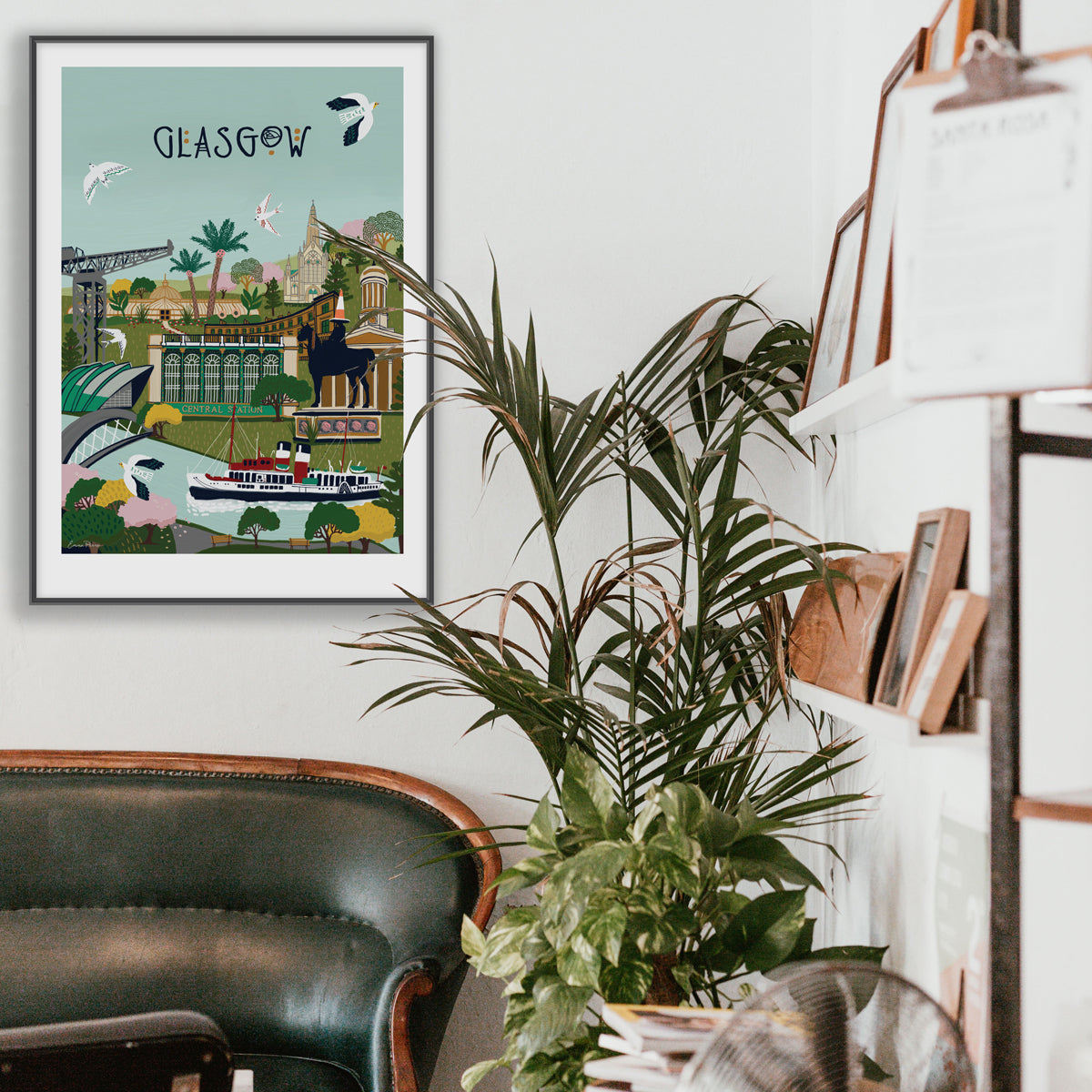 Framed Travel Poster of Glasgow in Scotland showing the Waverley, river clyde, cathedral and Central Station in a living room setting