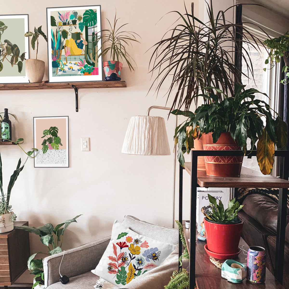 Wall art by Studio Peers.  Cosy Nook, Monstera Illustration and Botanical Bee Cushion.