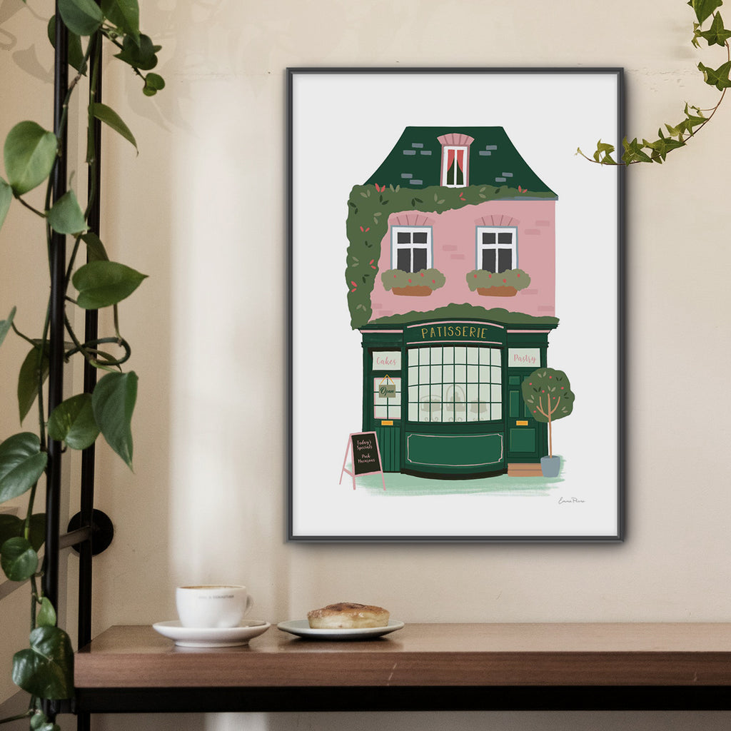 Wall Art Print of Patisserie French Bakery selling cakes and pastries in Parisian street.  Framed mock in cafe illustrated by Studio Peers