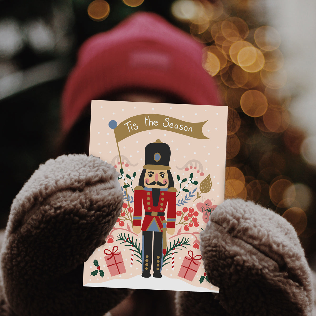 Tis the Season Christmas Card - Toy Soldier flying a Tis the Season flag and surrounded by Floral decorations. Merry Christmas Gift Shop